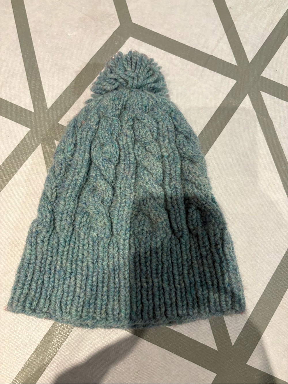 3/15$ Cable Knit Pom Pom Beanie in Heathered Teal